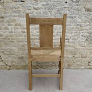 Fauteuil néo basque en bois clair et assise cannée