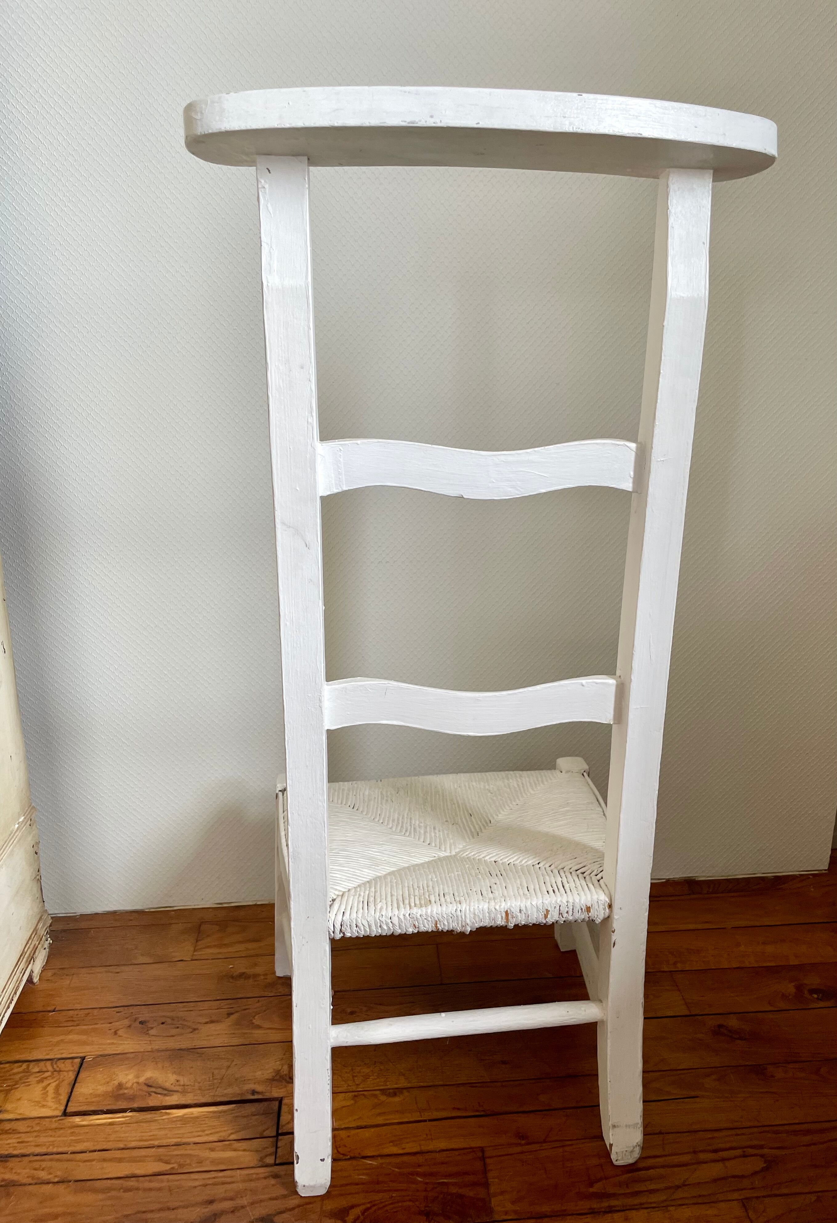 Old white mulched wooden chair