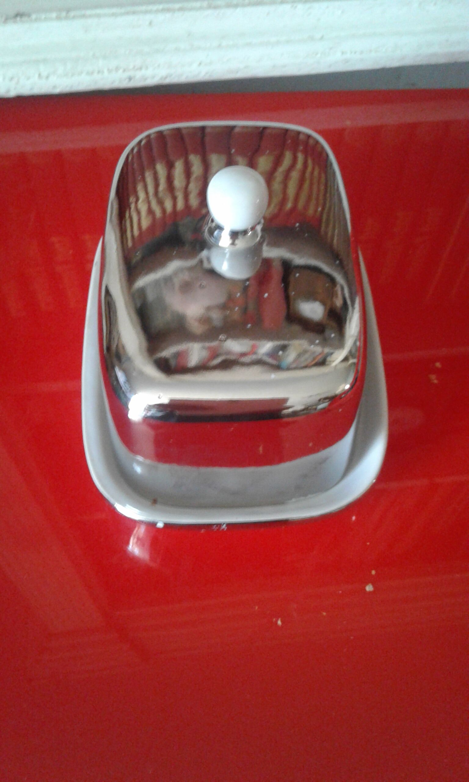 White and silver ceramic butter dish