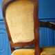Velvet cabriolet armchair with decorative copper studs.