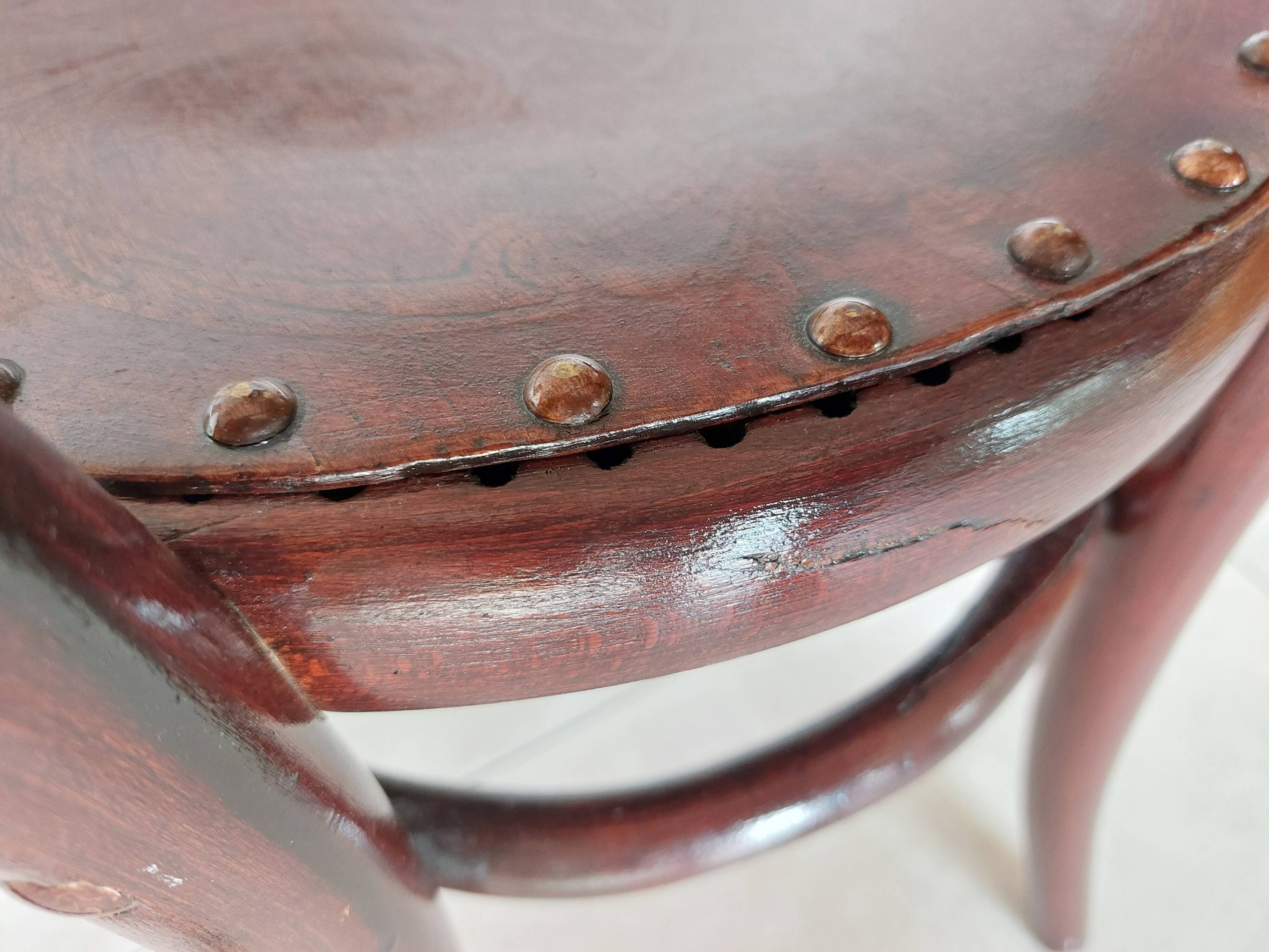 pair of round bistro chairs with a pattern on the seat, vintage