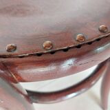 pair of round bistro chairs with a pattern on the seat, vintage