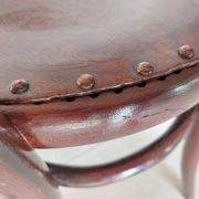 pair of round bistro chairs with a pattern on the seat, vintage