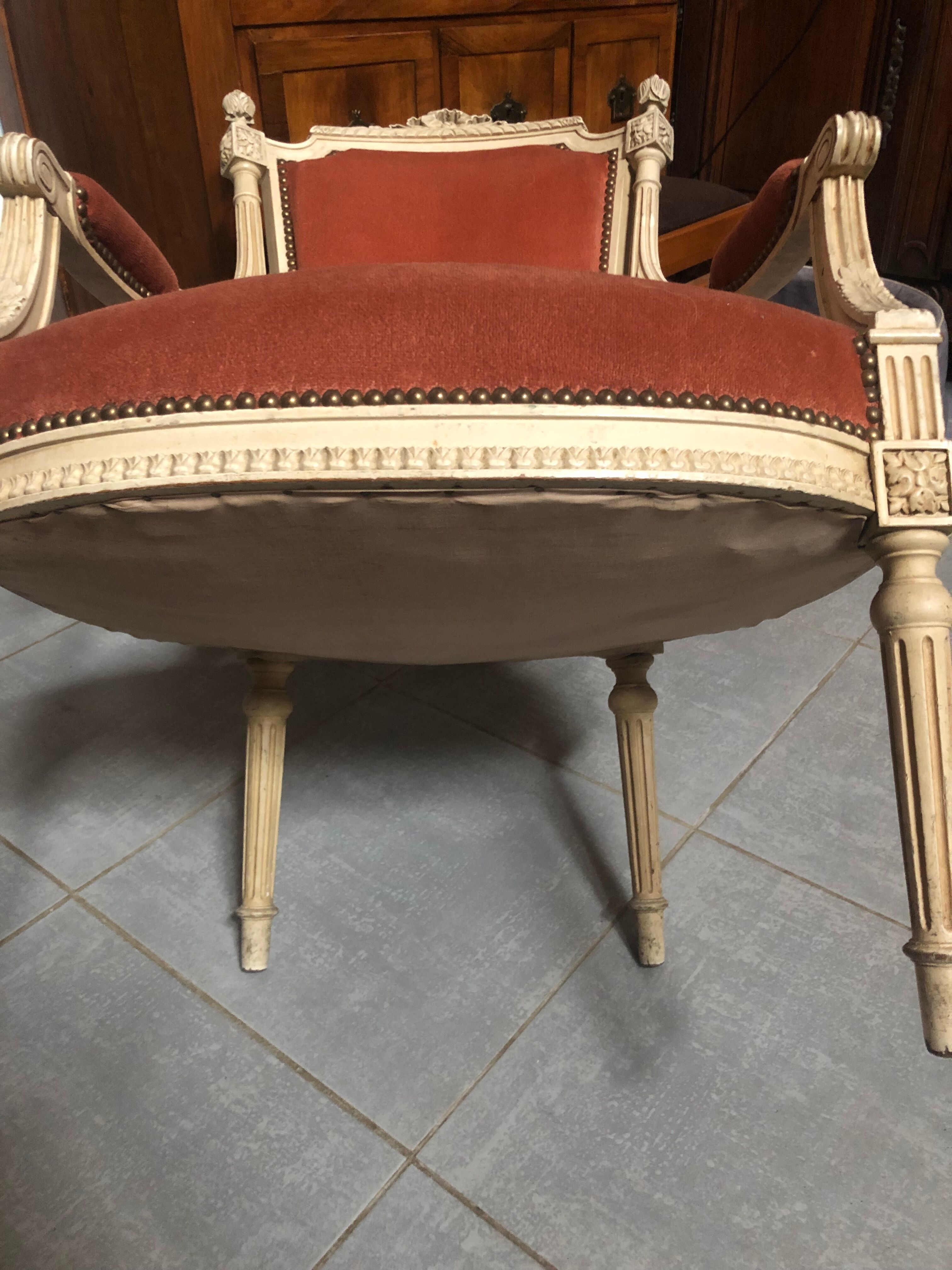 Patinated armchair in Louis XVI style
