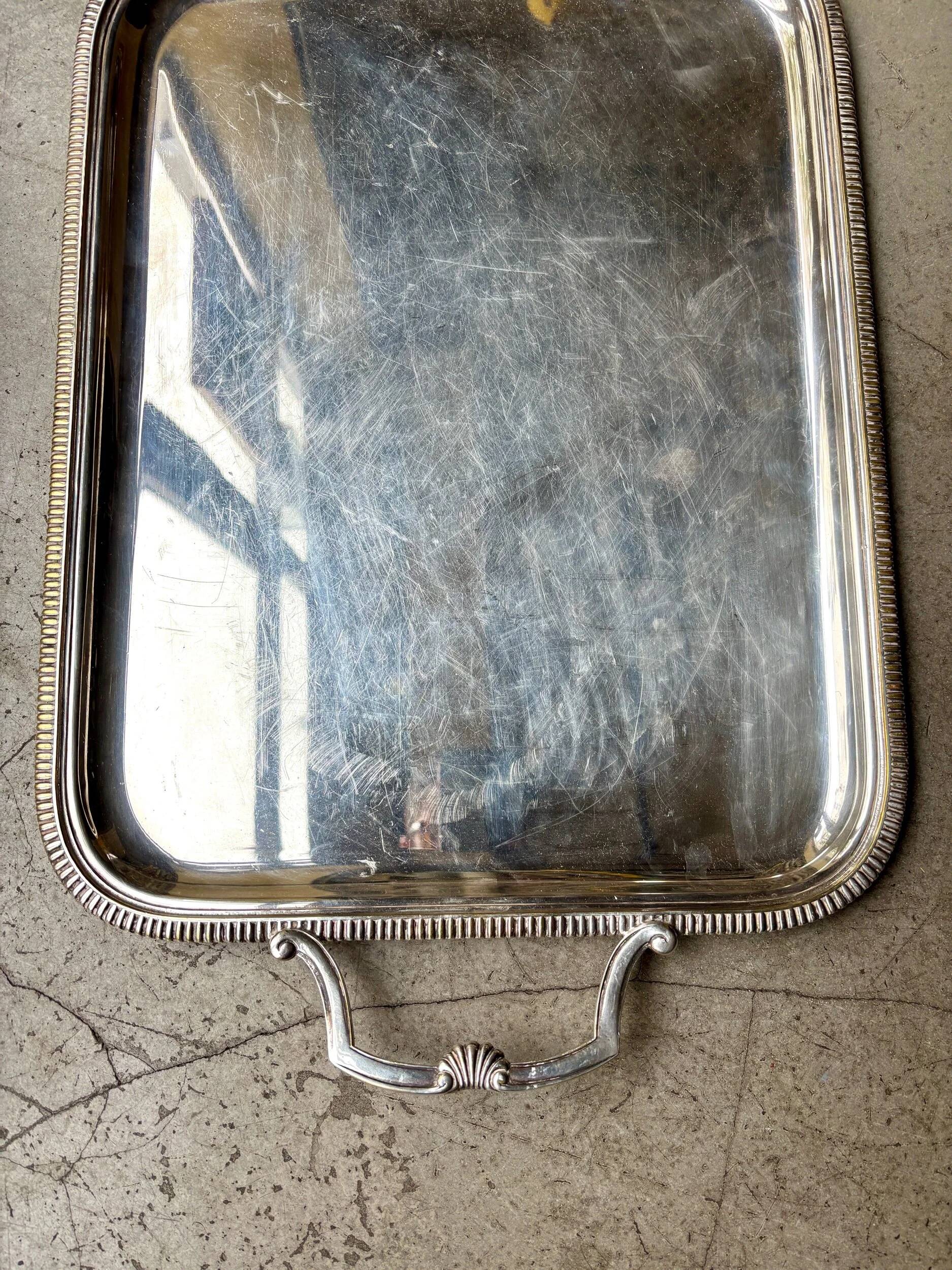 Rectangular silver-plated metal tray with a striated and shell design