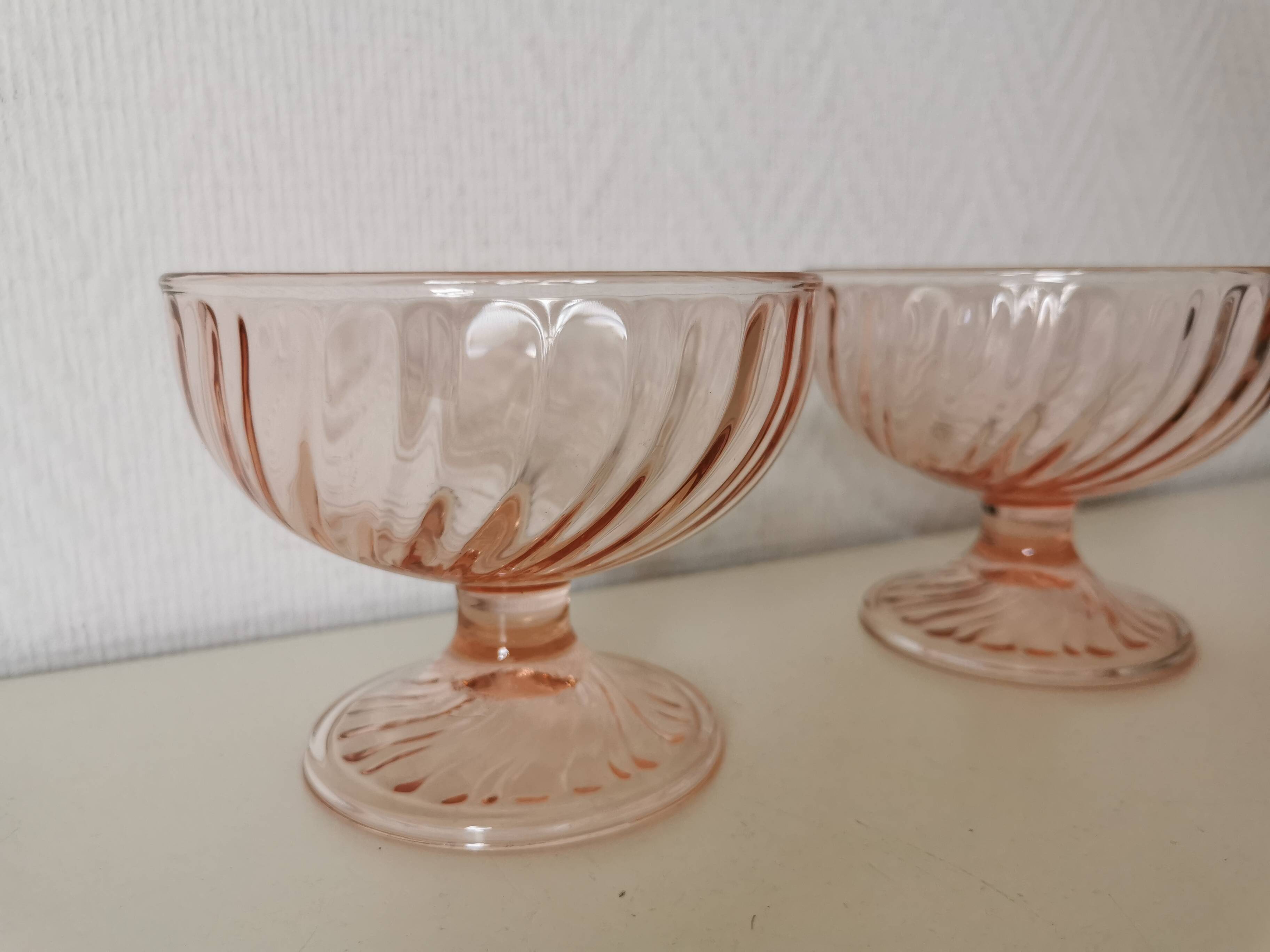 Pair of pink rosaline swirl glass fruit bowls
