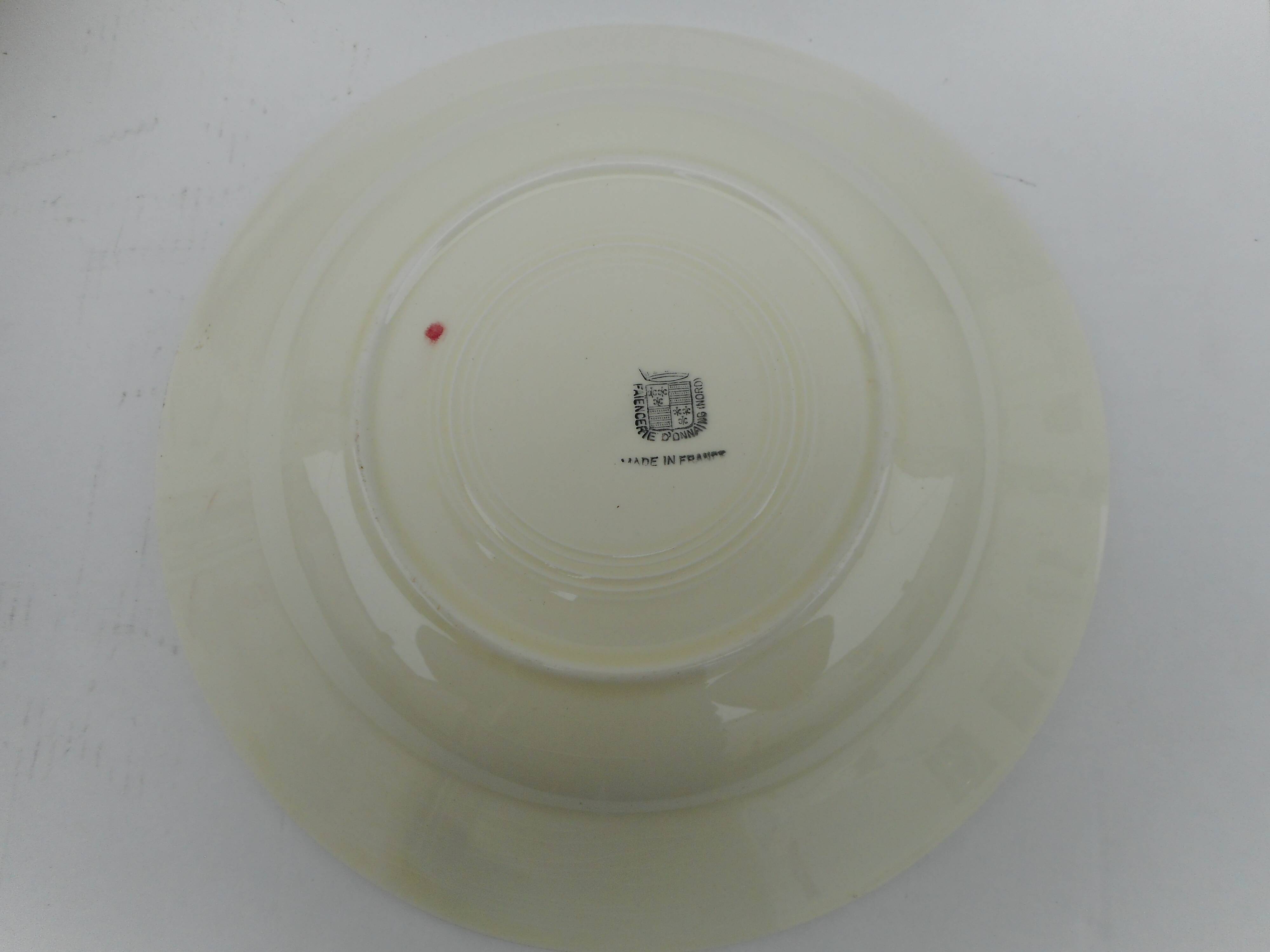Six hollow earthenware plates