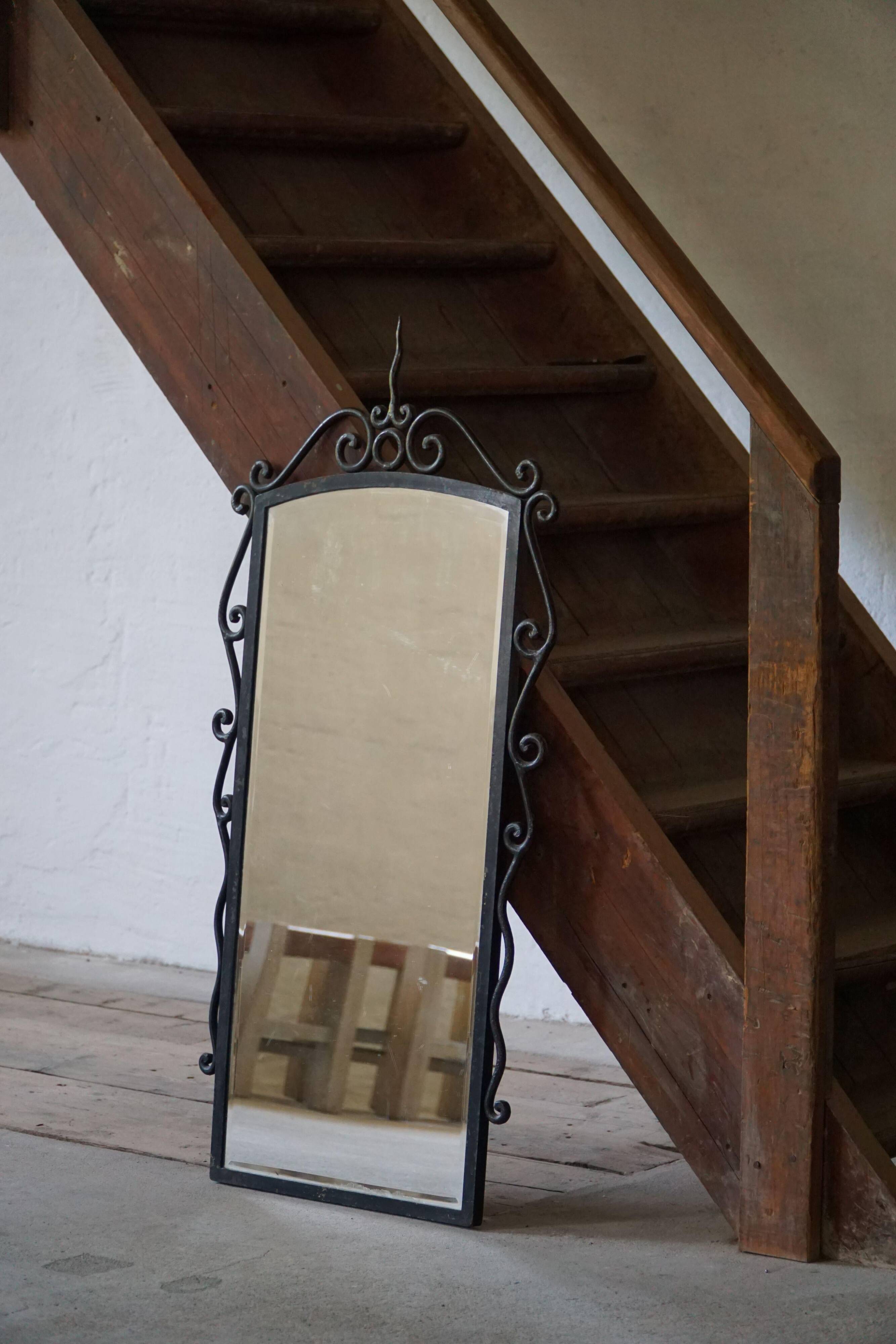 French mid-century brutalist wall mirror in wrought iron, made in the 1950s.