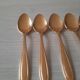 Small golden metal spoons