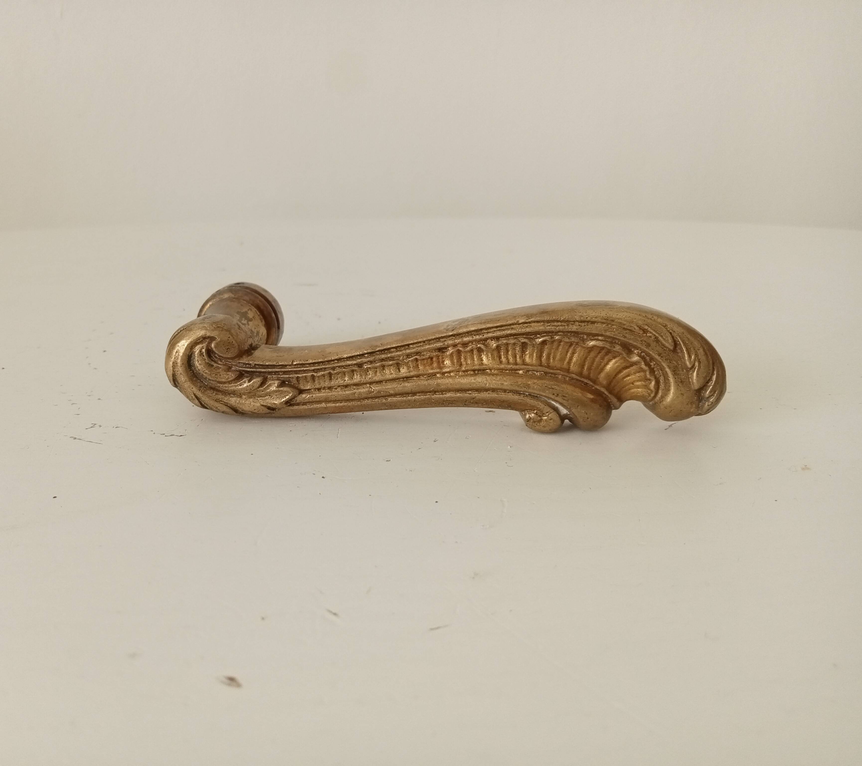 Antique bronze door handle in Empire style