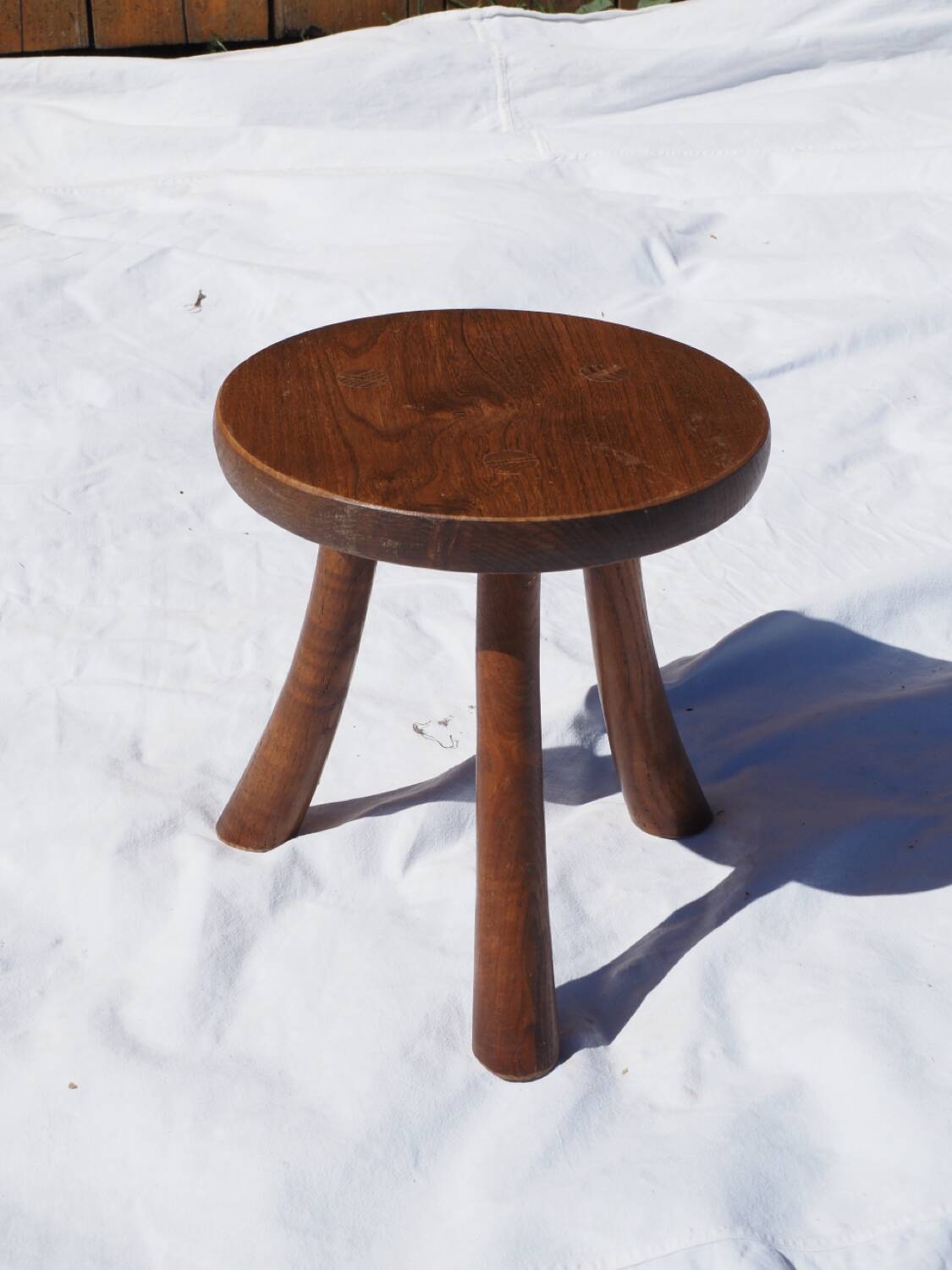 Old rustic milking stool