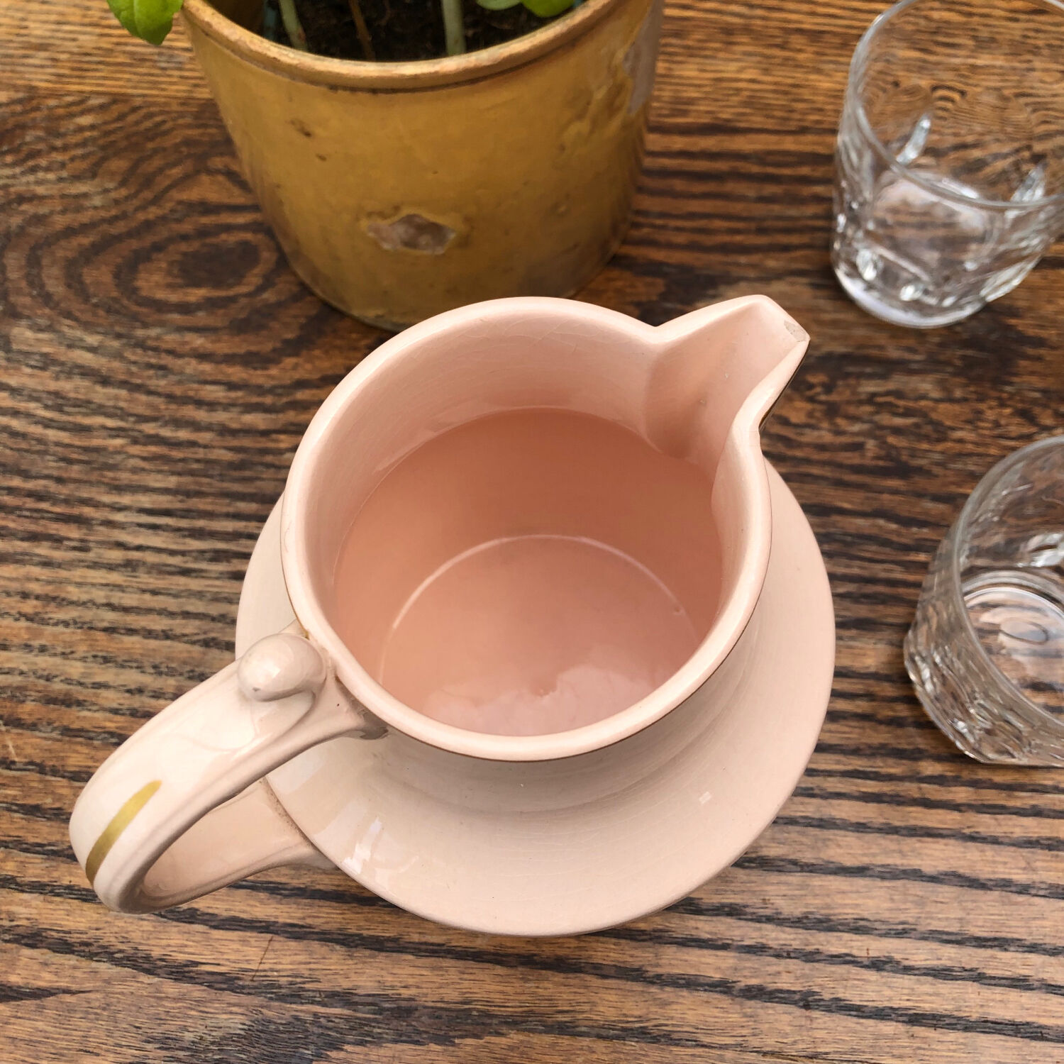 Antique pitcher in pink ceramic