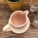 Antique pitcher in pink ceramic