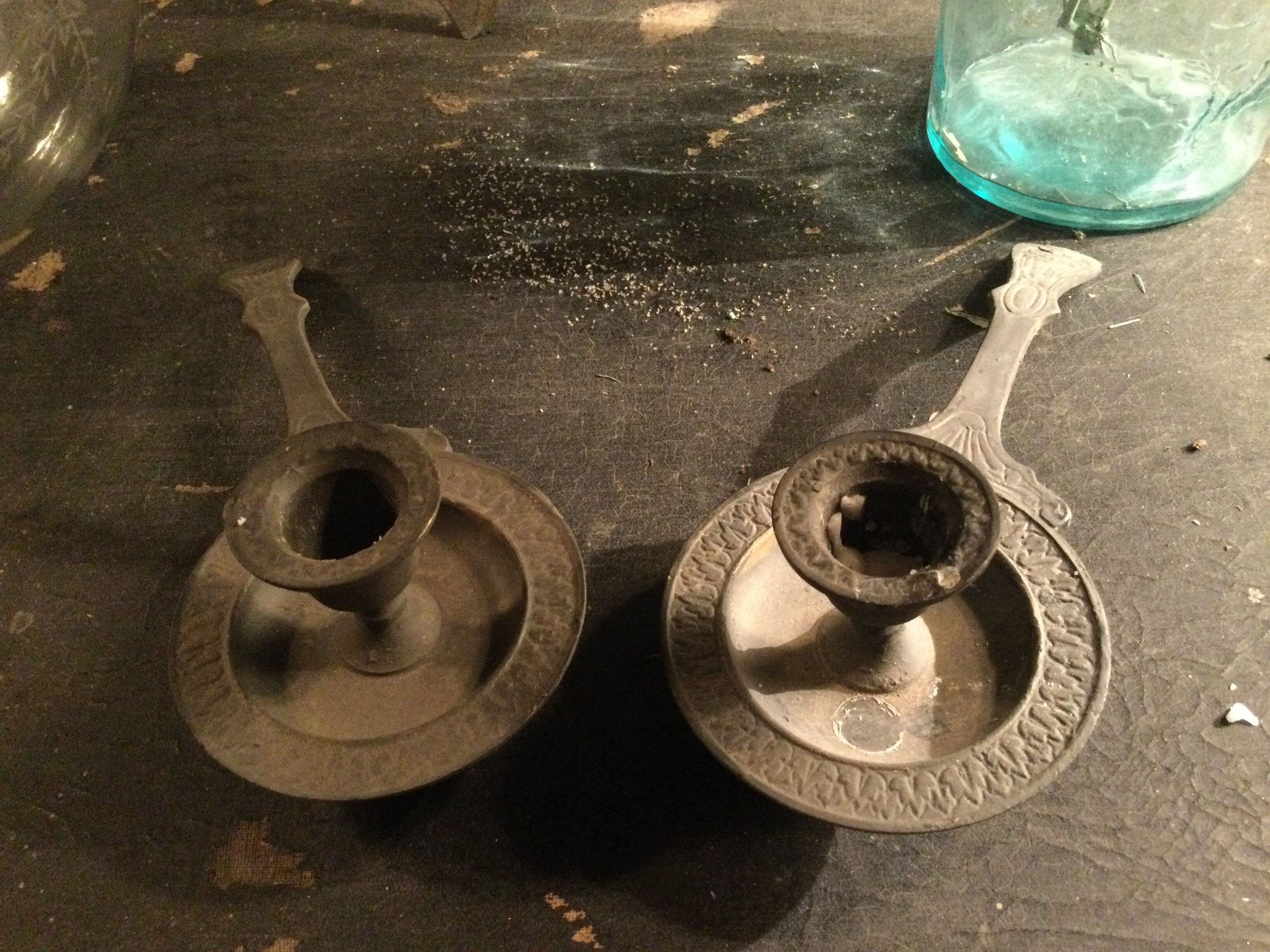 Pair of cast iron candle holders