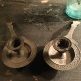 Pair of cast iron candle holders