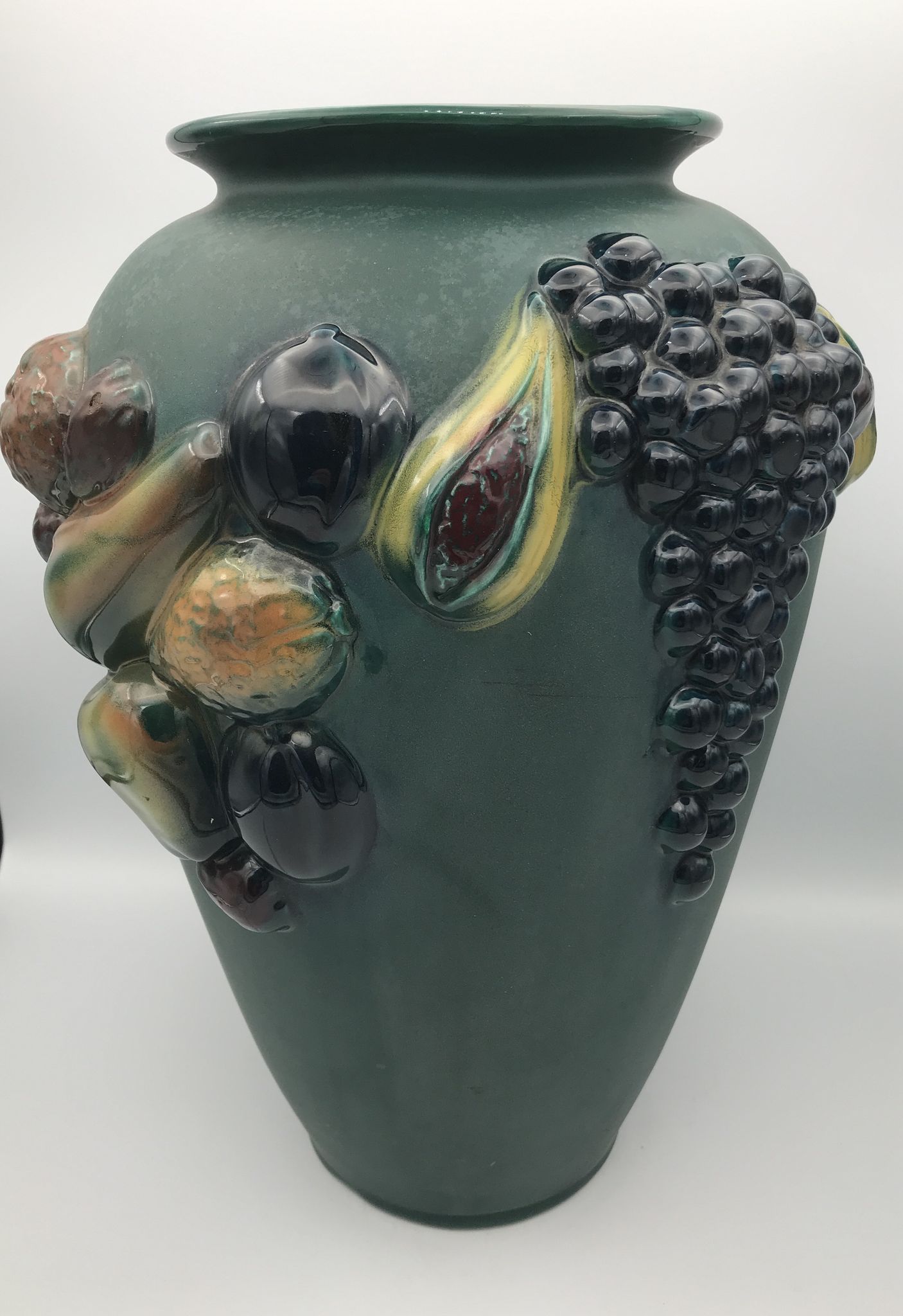 Green ceramic vase with polychrome decoration of fruits and vegetables in relief 33.5 cm