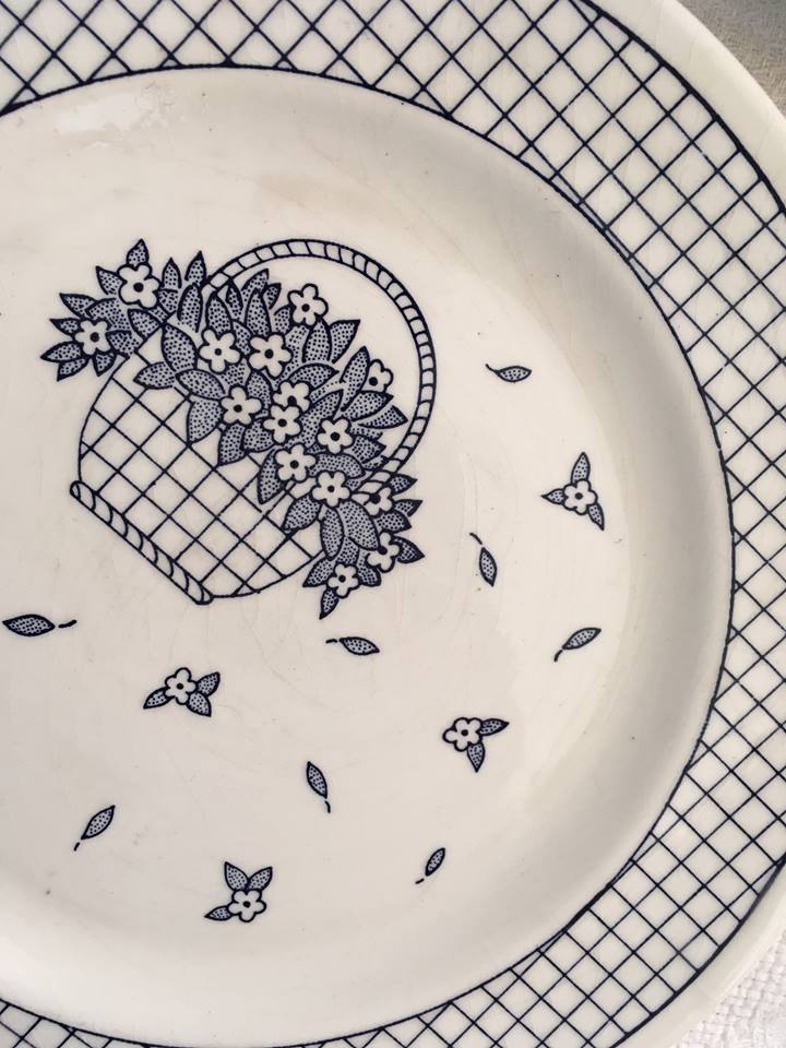 Together seven dessert plates mismatched in blue.