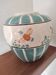 Round ceramic vase with cloisonné decoration of wild ducks.