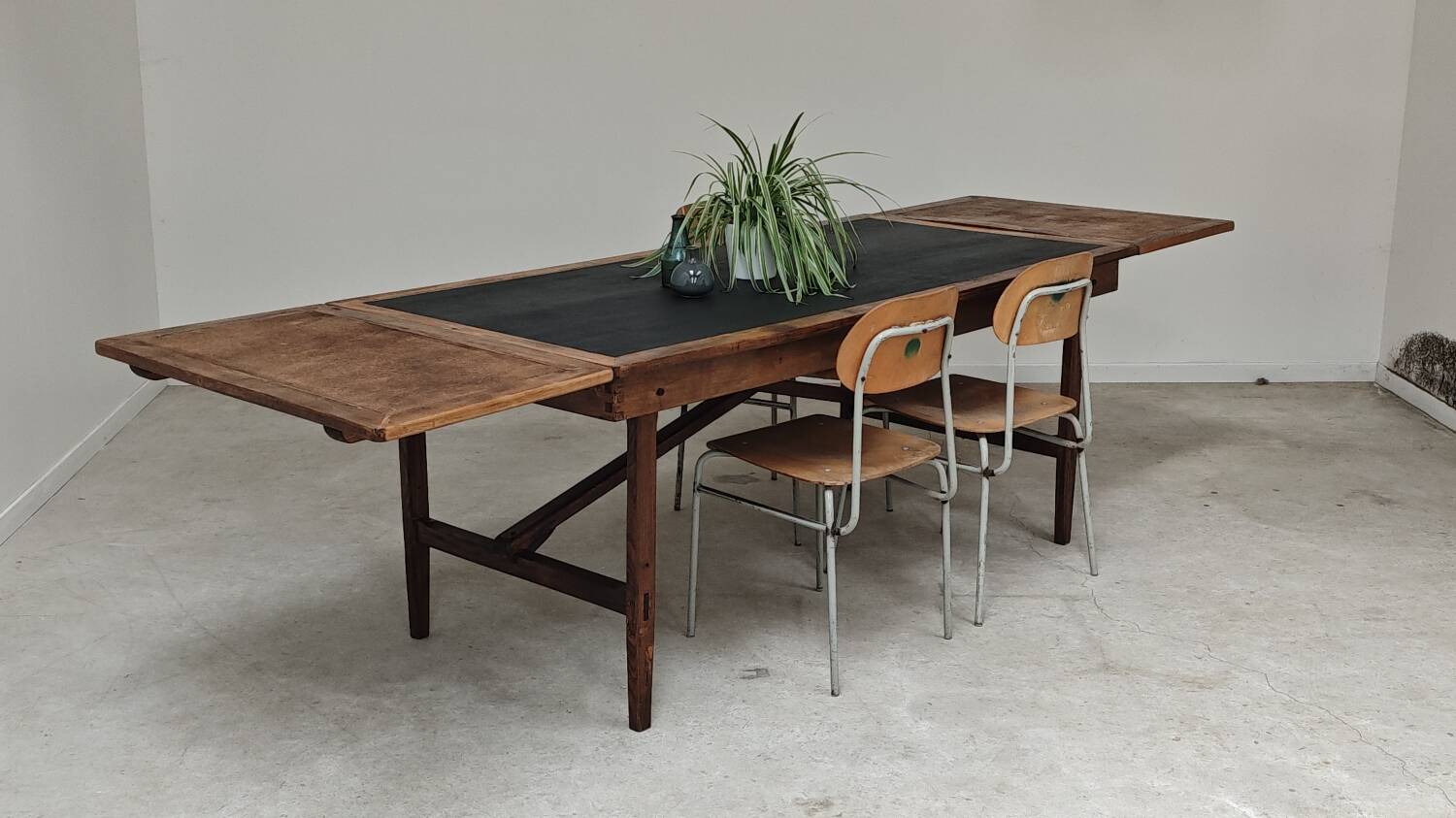 Vintage workshop folding table in oak with a hand-patinated black top.