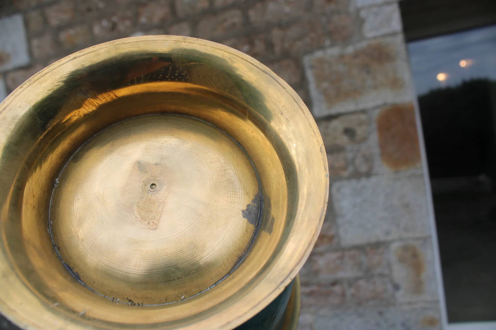 Vintage turquoise brass champagne bucket with grape decoration.