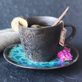 Cup and saucer bronze ceramic