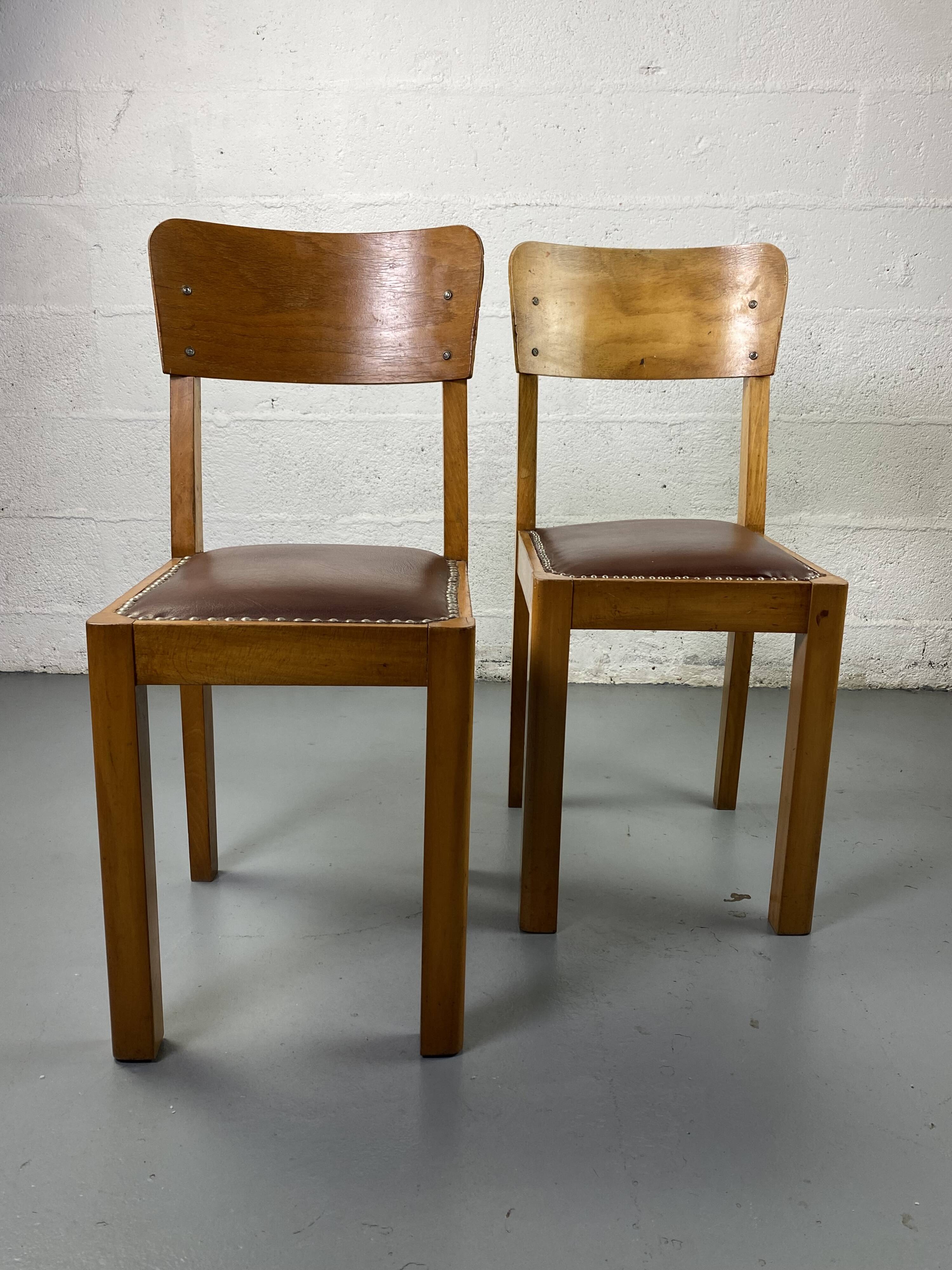 Pair of wooden and leather chairs