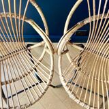 Paire de fauteuils corbeille en rotin - vers 1960.
