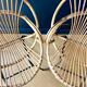Paire de fauteuils corbeille en rotin - vers 1960.