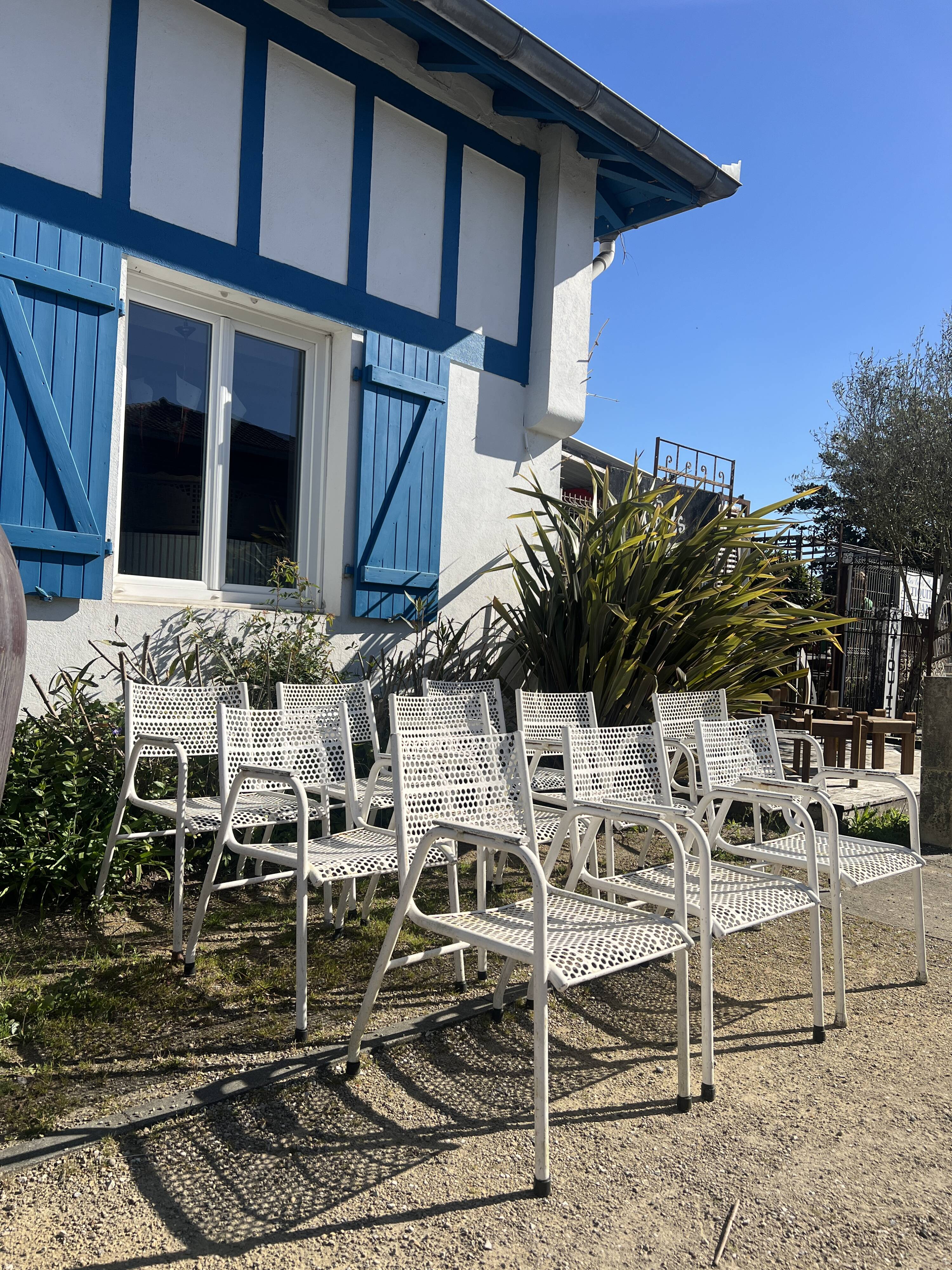 Set of 10 perforated metal garden chairs