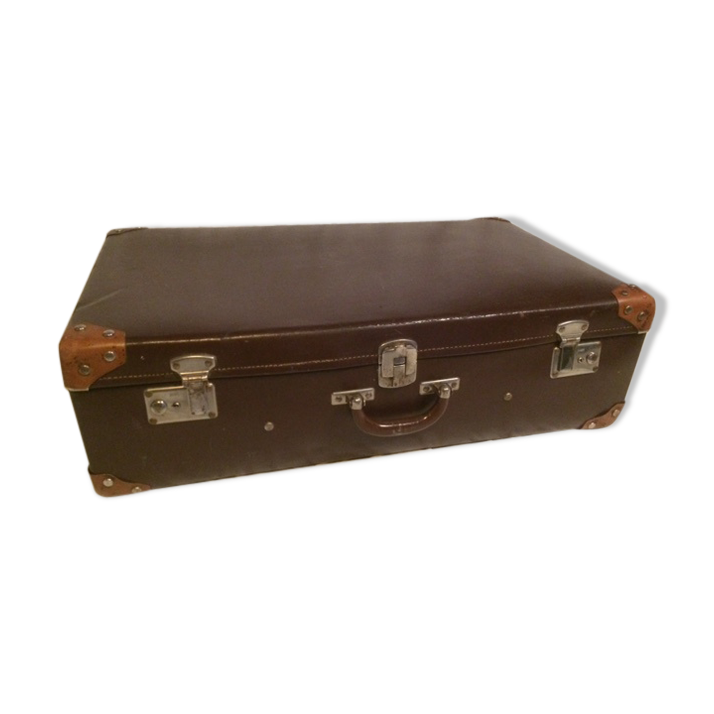 Suitcase vintage leather inside and brown carpeted home