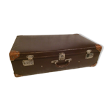 Suitcase vintage leather inside and brown carpeted home