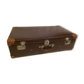 Suitcase vintage leather inside and brown carpeted home