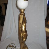 Lamp depicting a with a drape