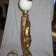 Lamp depicting a with a drape