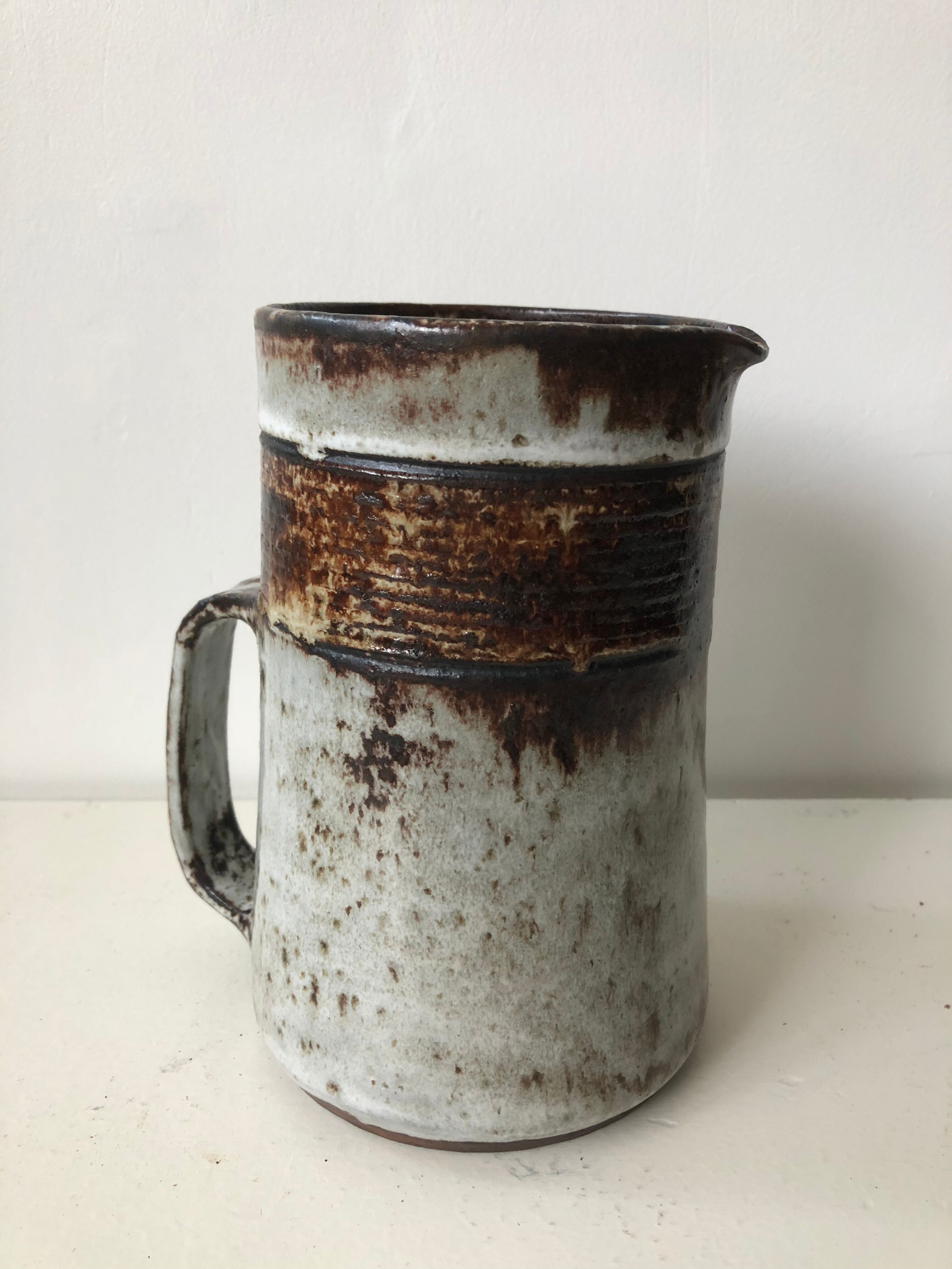 Brown grey enamelled stoneware pitcher