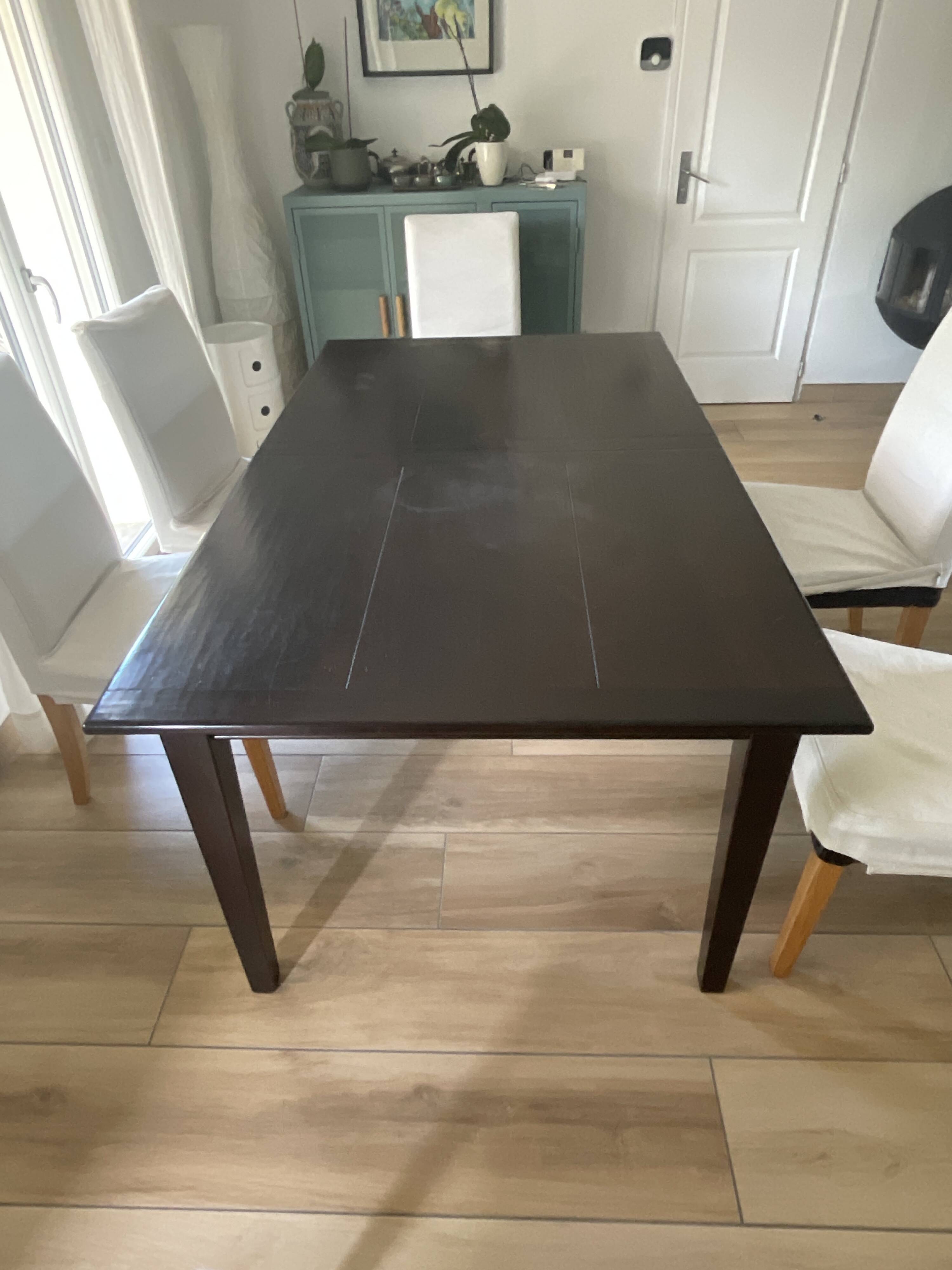 Solid cherry wood dining table, extendable for 8 to 12 people.