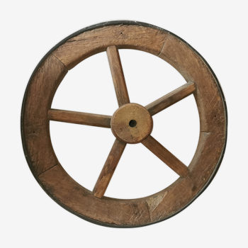 Old wheelbarrow or plow wheel