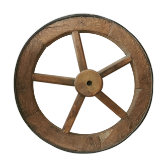Old wheelbarrow or plow wheel