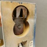 Milky white Holmegaard wall lamp with glass shade and a brass detail on top. Wooden wall bracket