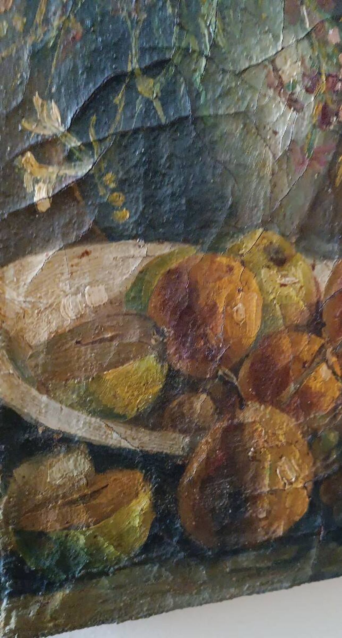 19th-century oil painting on canvas depicting a vase of fruit with flowers.
