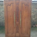 Louis XV Nantaise wardrobe carved with grape clusters, cherry gendarme hat at the end of the 19th century.