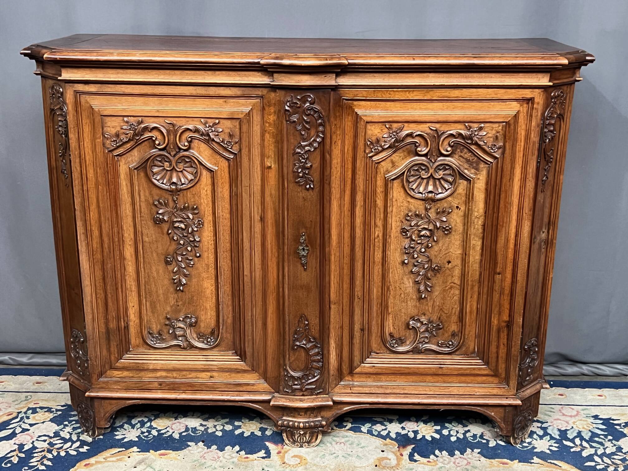 Louis XV style carved walnut chest of drawers