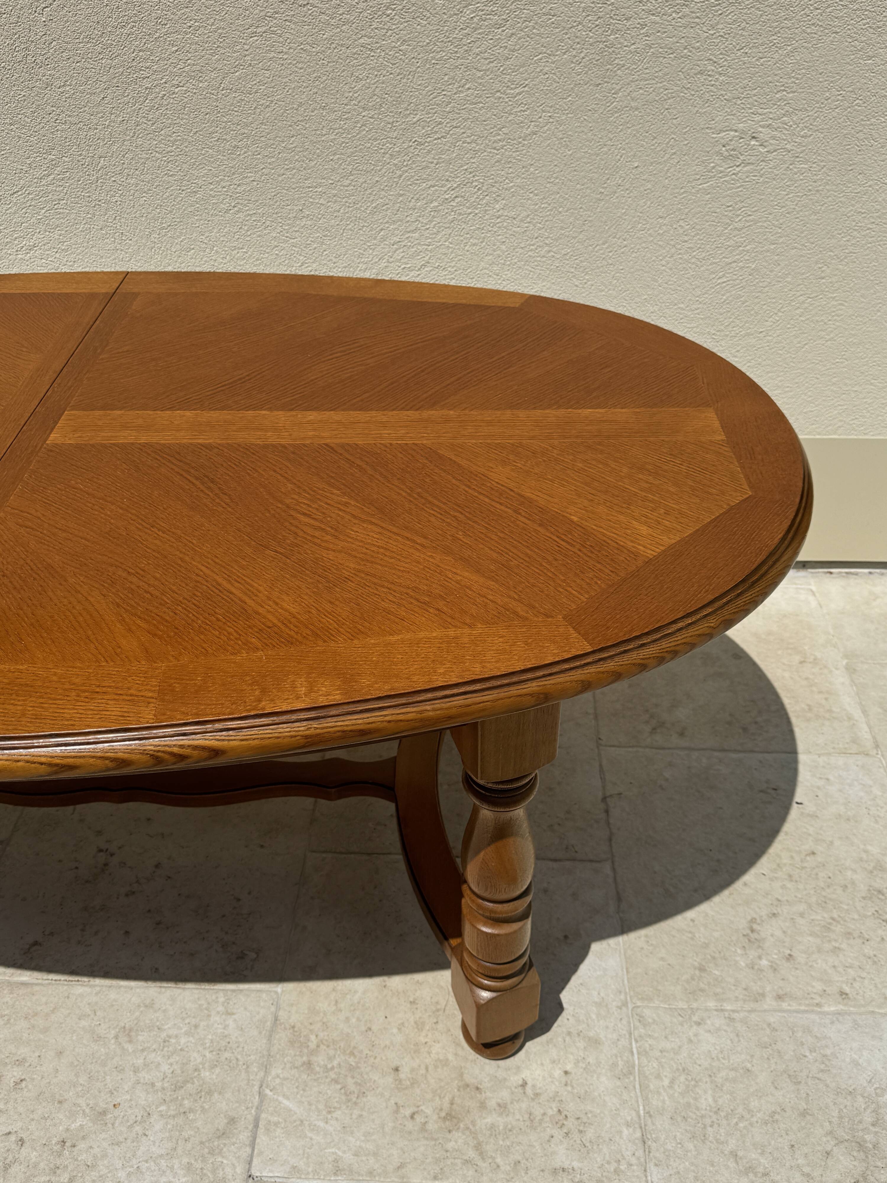 Oak dining table, oval living room table with two extensions.