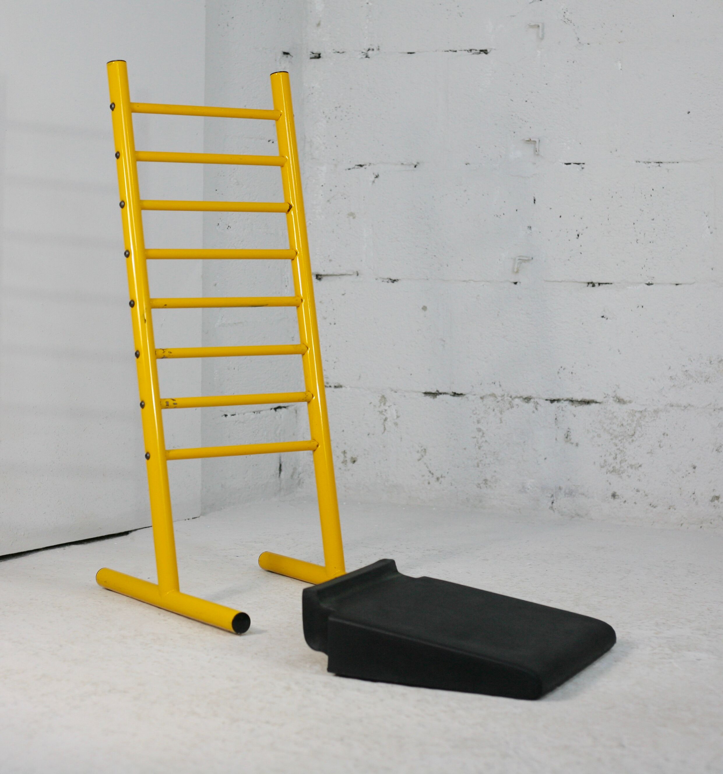 Adjustable seat chair. Circa 1980. Italy. Yellow lacquered steel.