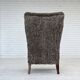 1960s, reupholstered Danish armchair, with stool, genuine sheepskin.