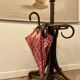 Umbrella holder in arched and dark wood