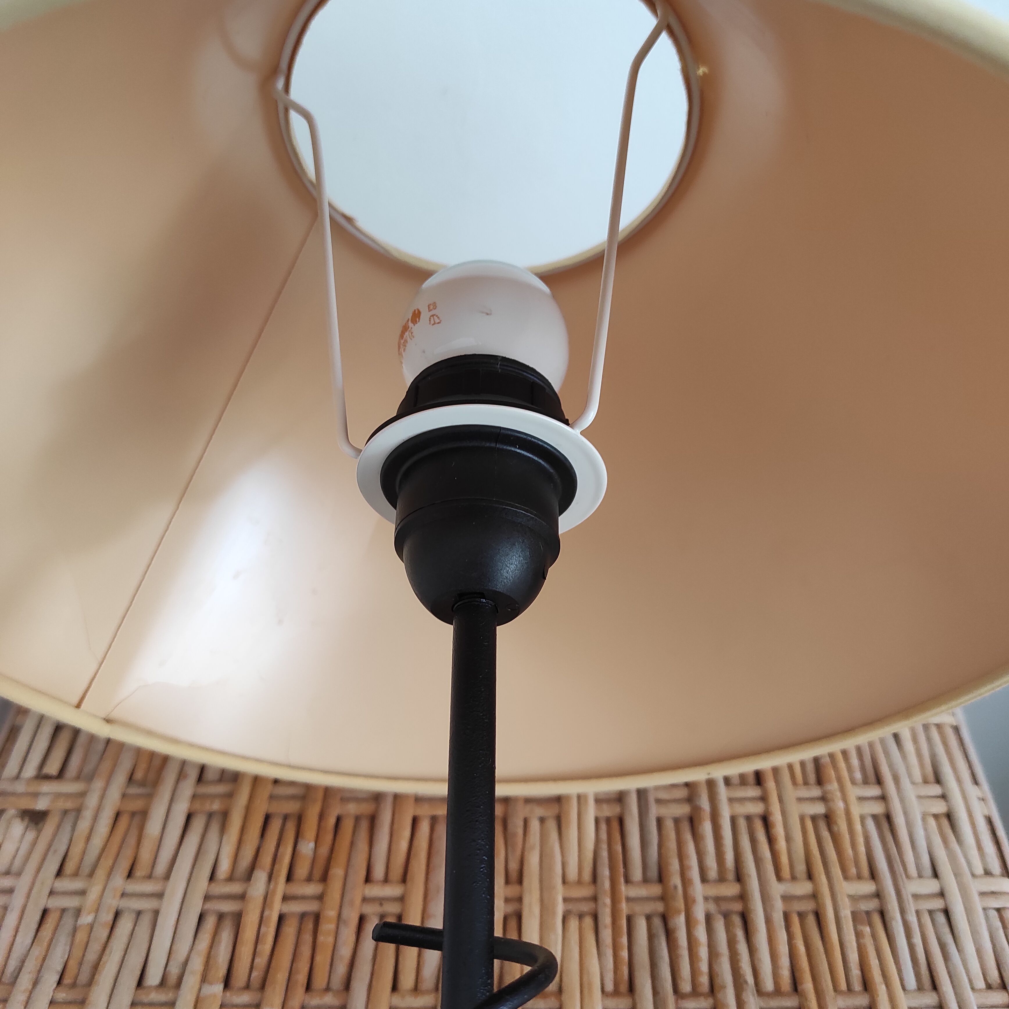 Black wrought iron table lamp and beige lampshade