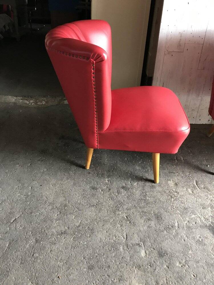 Mid-century cocktail chair in red vinyl and beech, 1950s design from Czechoslovakia.