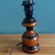 Turned wood bedside lamp with fabric lampshade