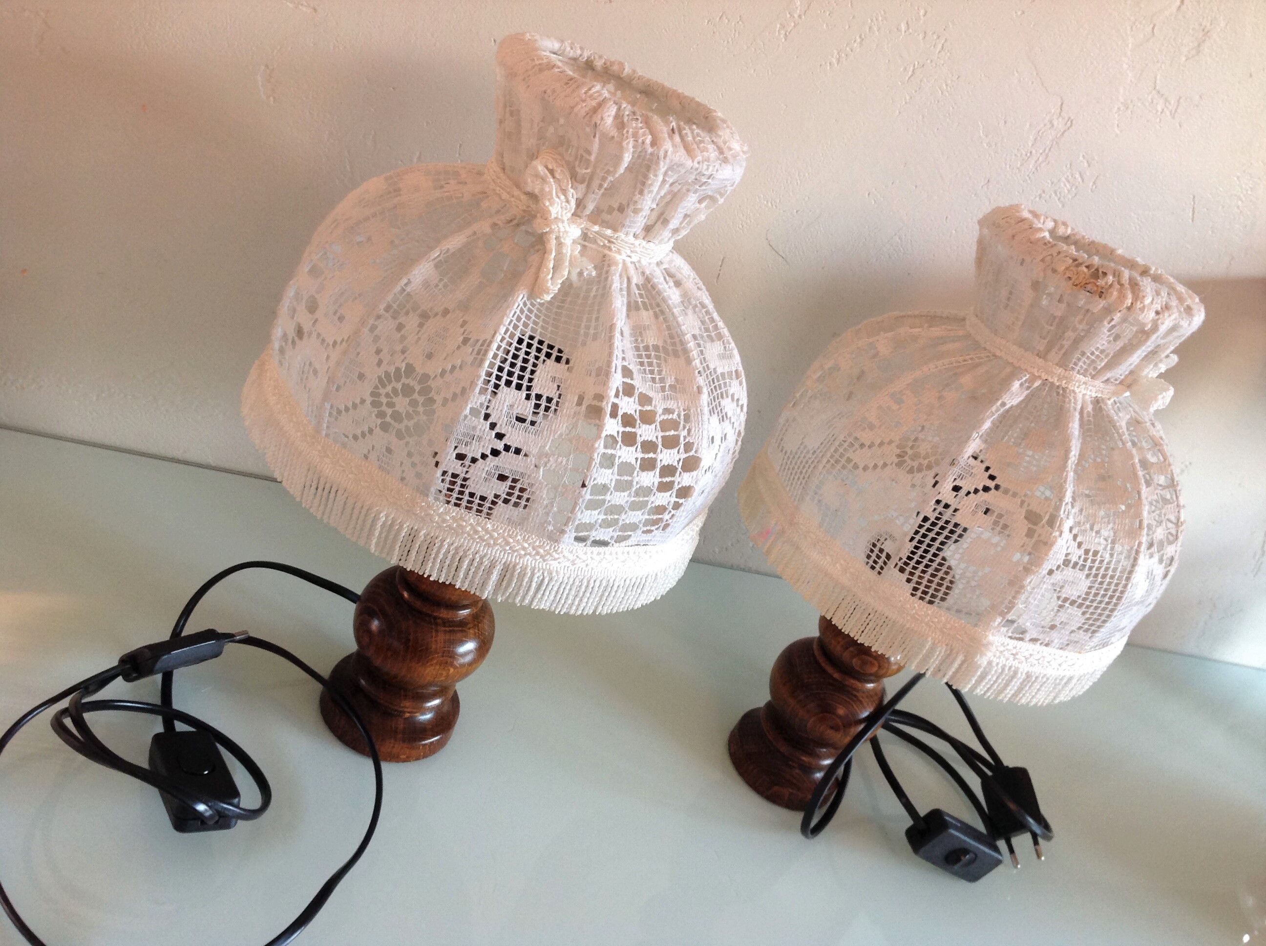 Pair of turned wooden bedside lamps and lace/vintage lampshade 60s-70s